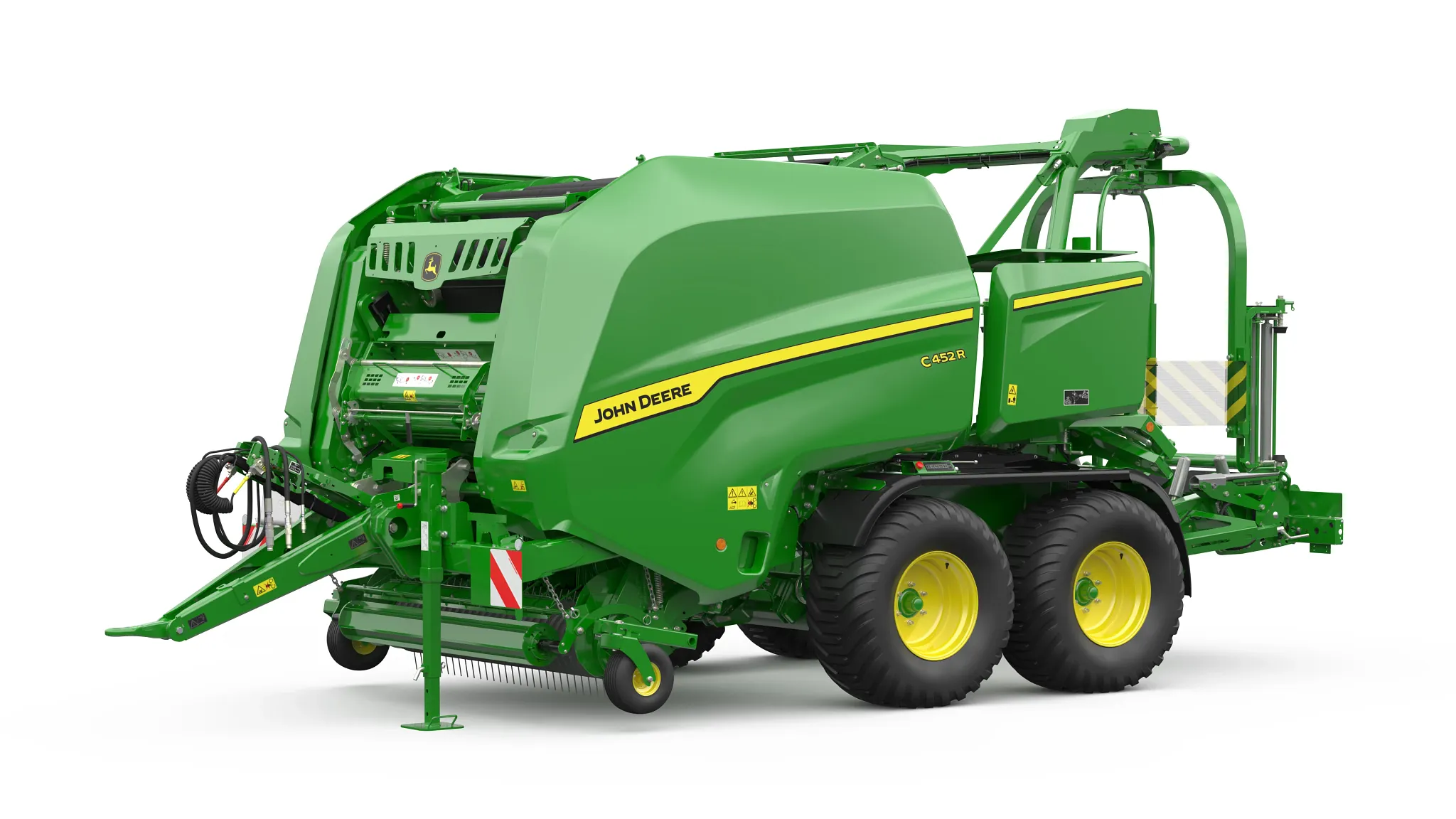 Χορτοδετικό κυλινδρικών δεμάτων John Deere C452R με ανοιχτό θάλαμο, συλλέκτη και μονάδα περιτύλιξης σε πλευρική όψη σε λευκό φόντο.